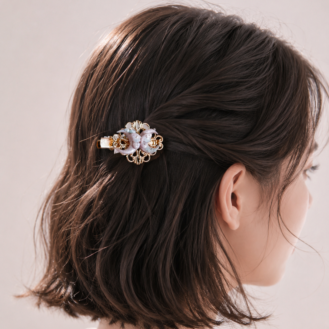 Close-up of a decorative hair clip in a person's hair against a neutral background